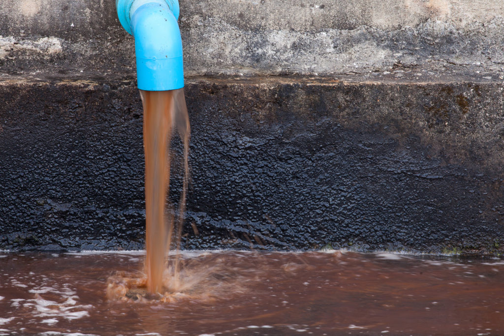 unfiltered water pouring from pipe