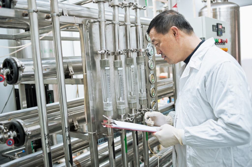 technician inspects filter tubes