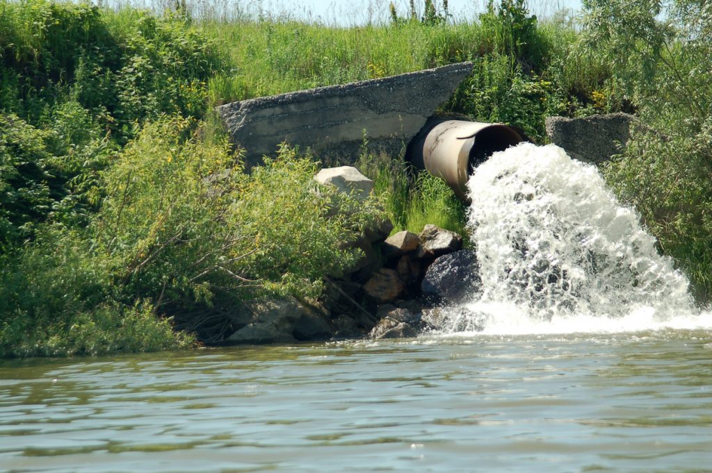 pipe dispensing water to stream